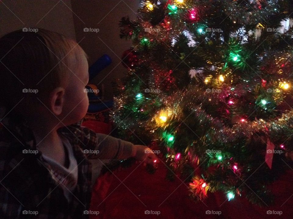 Baby admiring the Christmas tree!