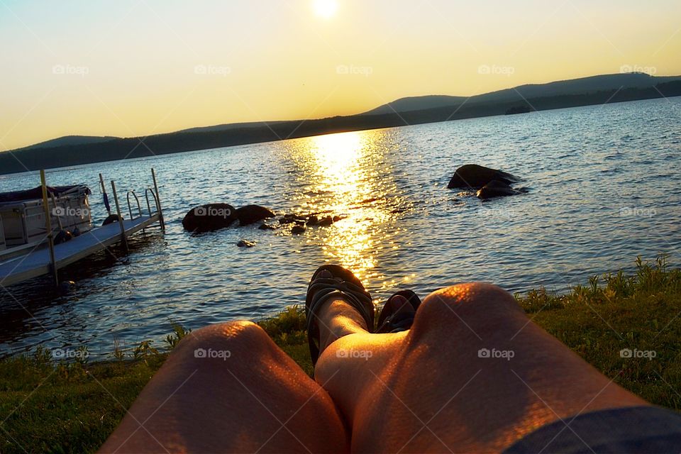 Golden glow of sunset. Relaxing in the golden glow of sunset at the lake