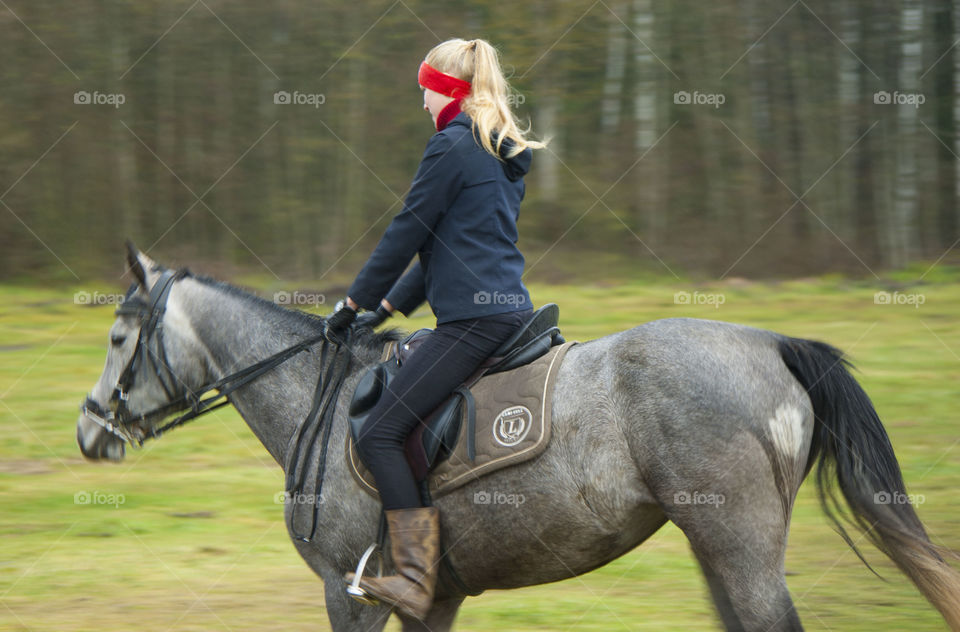 Girl riding a horse