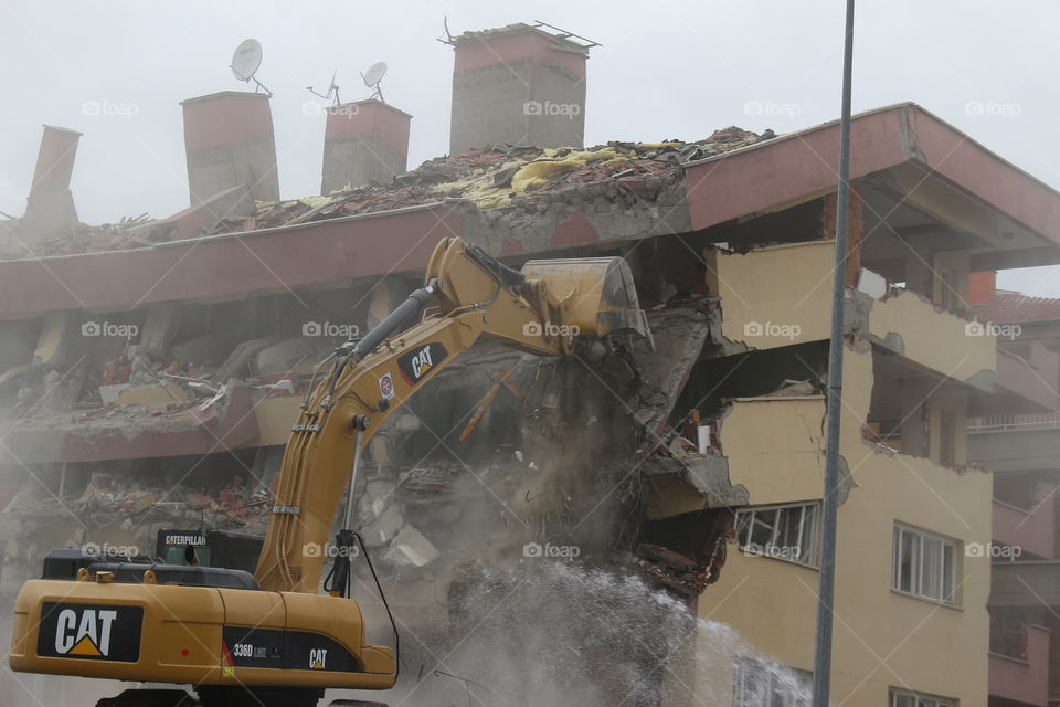 Knock down building by Bulldozer 