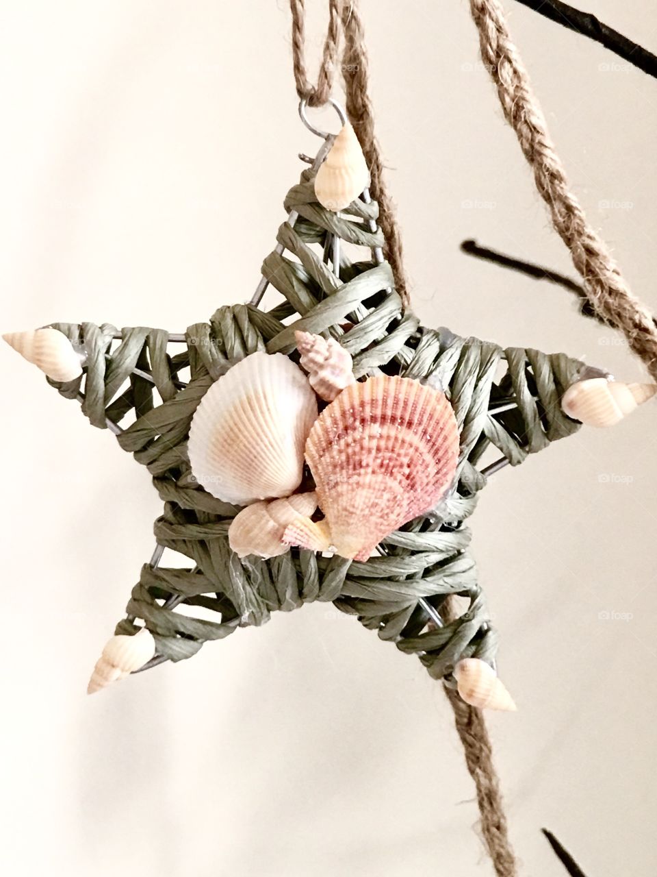 Wicker rattan star decorated with seashells, beach theme decor decoration 