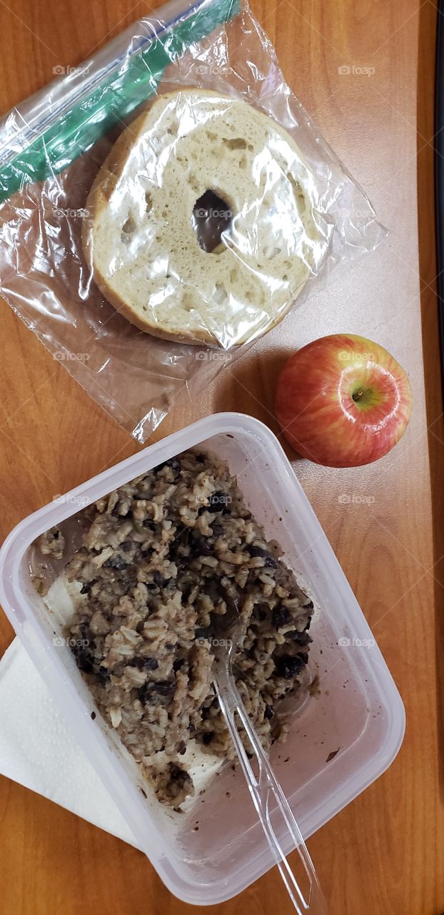 leftovers for lunch at work, black beans rice with half a bagel and an apple