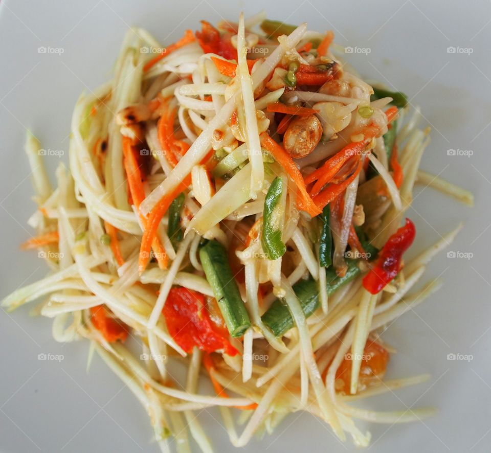 Som Tom Thai or papaya salad in Thai central part style, sweet,salty,sour and spicy