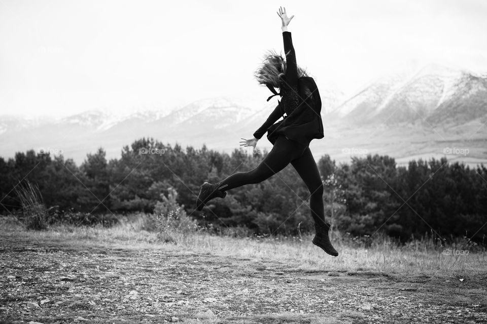 girl dancing on the mountain