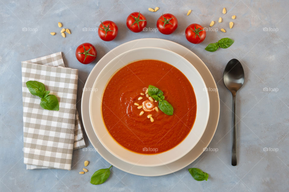 tomato soup with basil on a plate