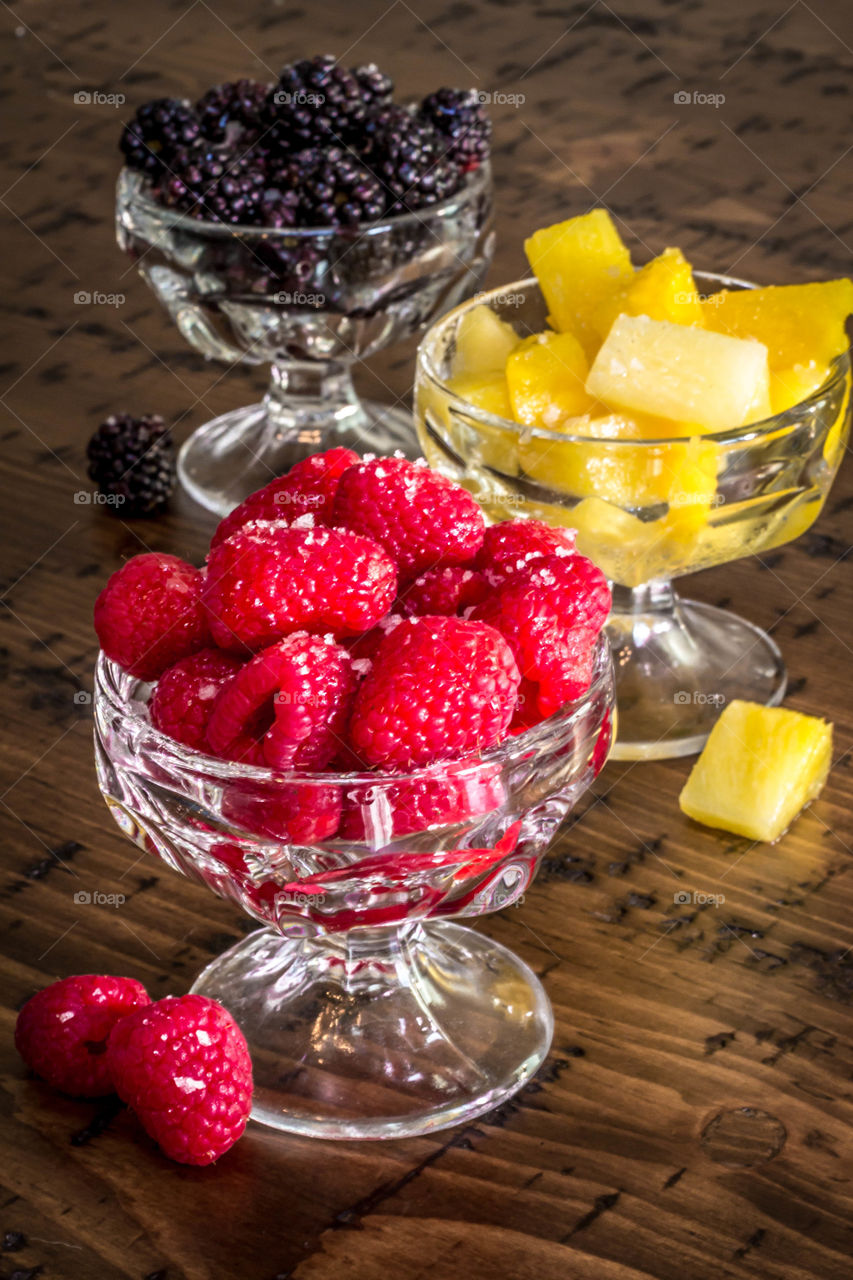 Varity of fruits in glass on table
