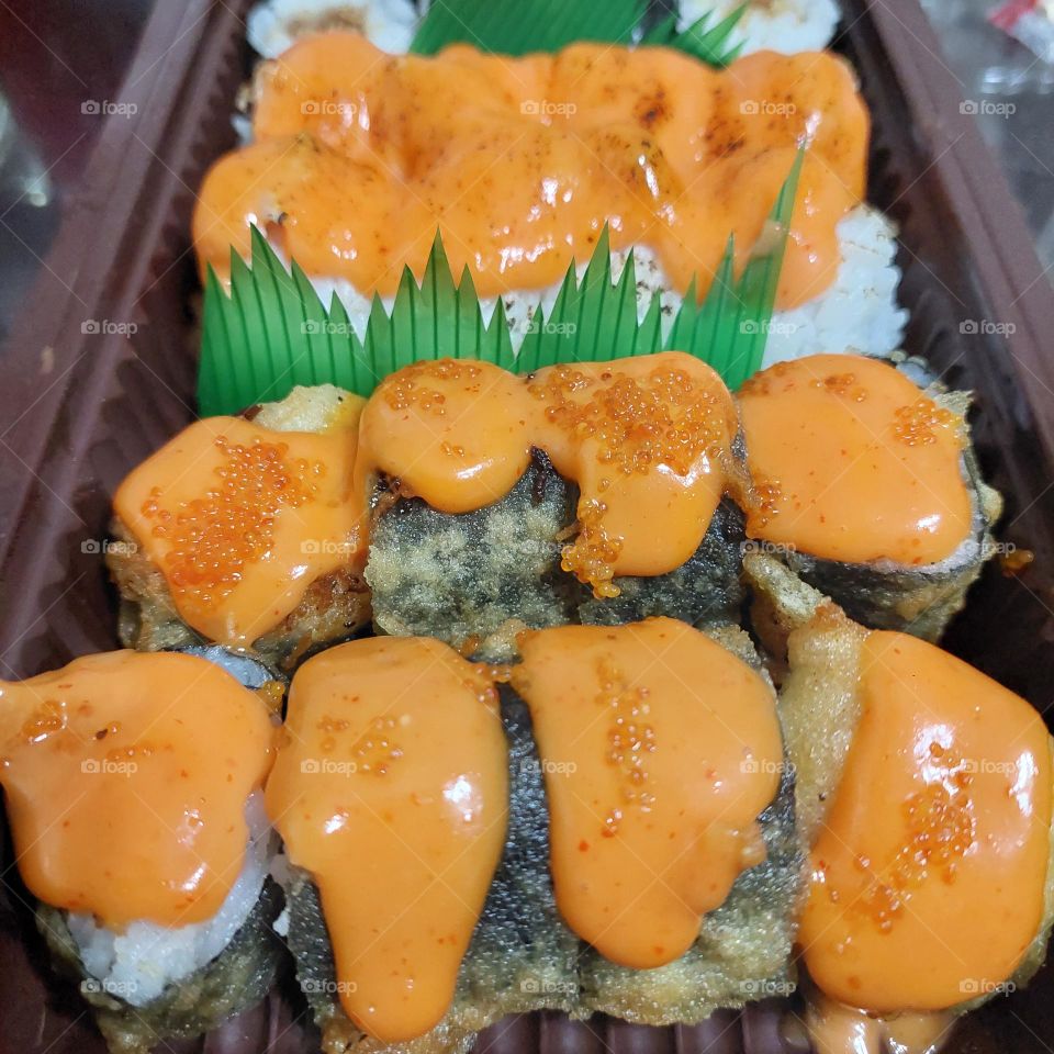 assorted sushi served in a container