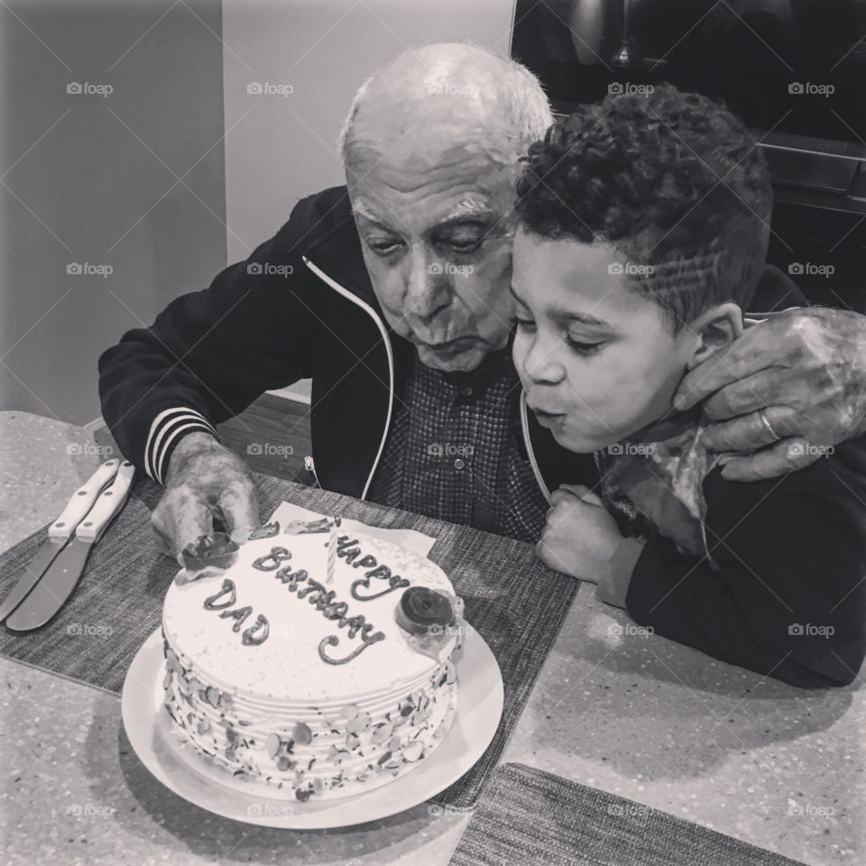 Grandson and grandfather celebrating birthday
