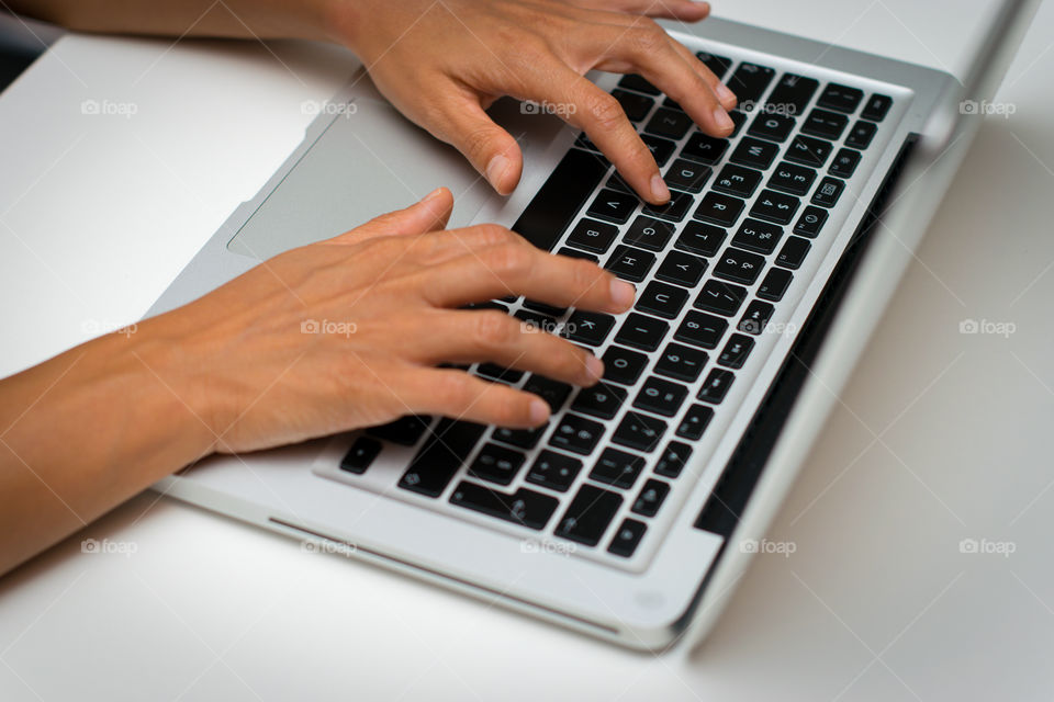 Woman while she is working at the computer