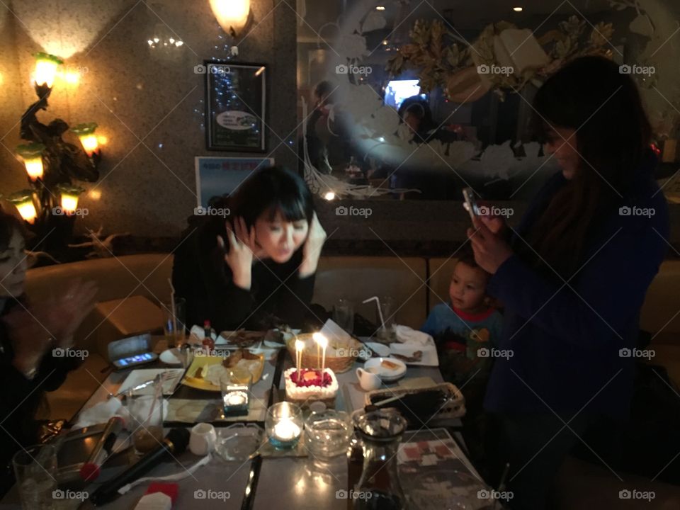 Women with kid celebrating, birthday