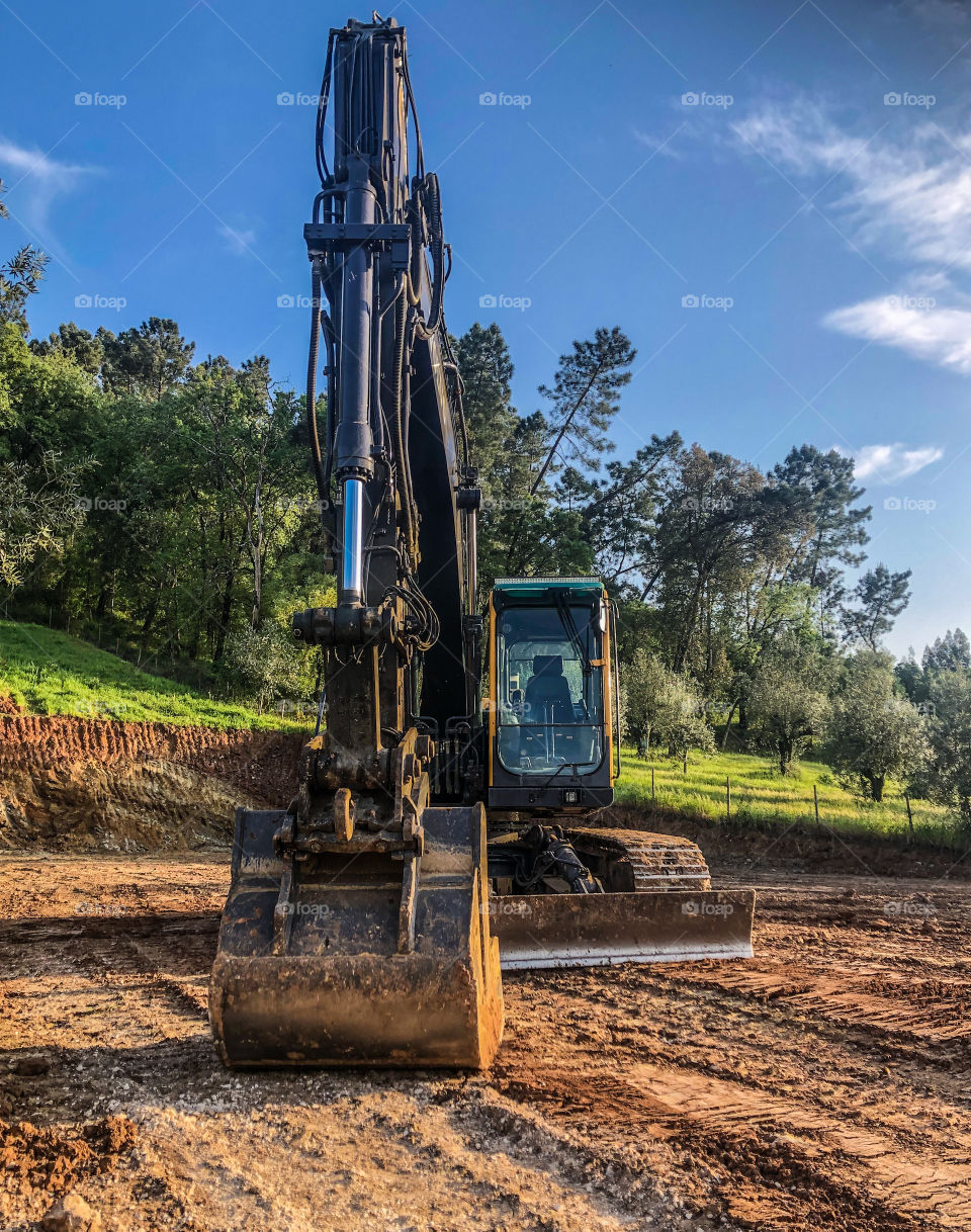 Volvo hydraulic excavator, seen with a countryside setting