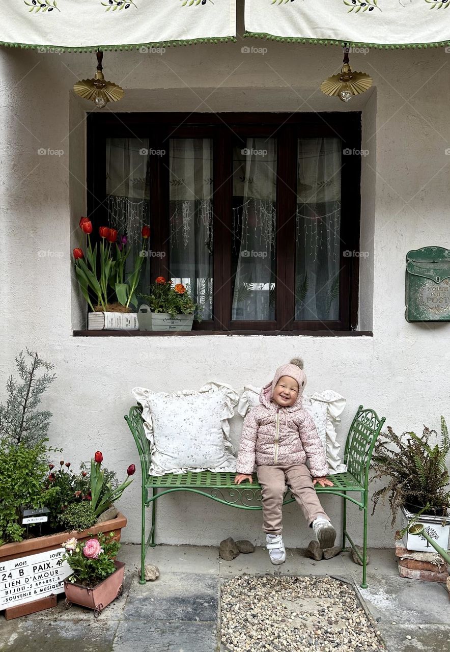 Cute baby girl and window 