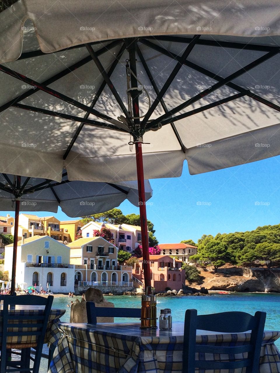 Beautiful bright sunny day in Assos ... colourful pastel painted houses against a turquoise Mediterranean Sea ... sunglasses to the ready 😎