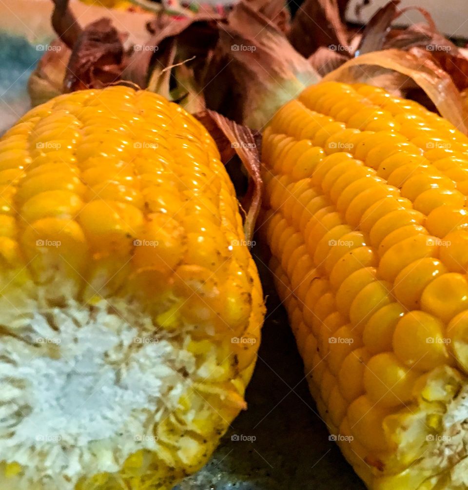 What's cooking? Roasted corn on the cob husks on closeup