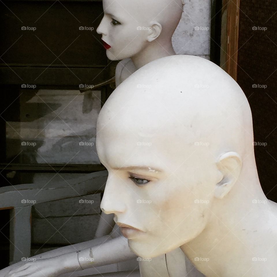 Human Mannequin heads ,thinking about something. man and women,photo taken in a fleet market in Jaffa , 
