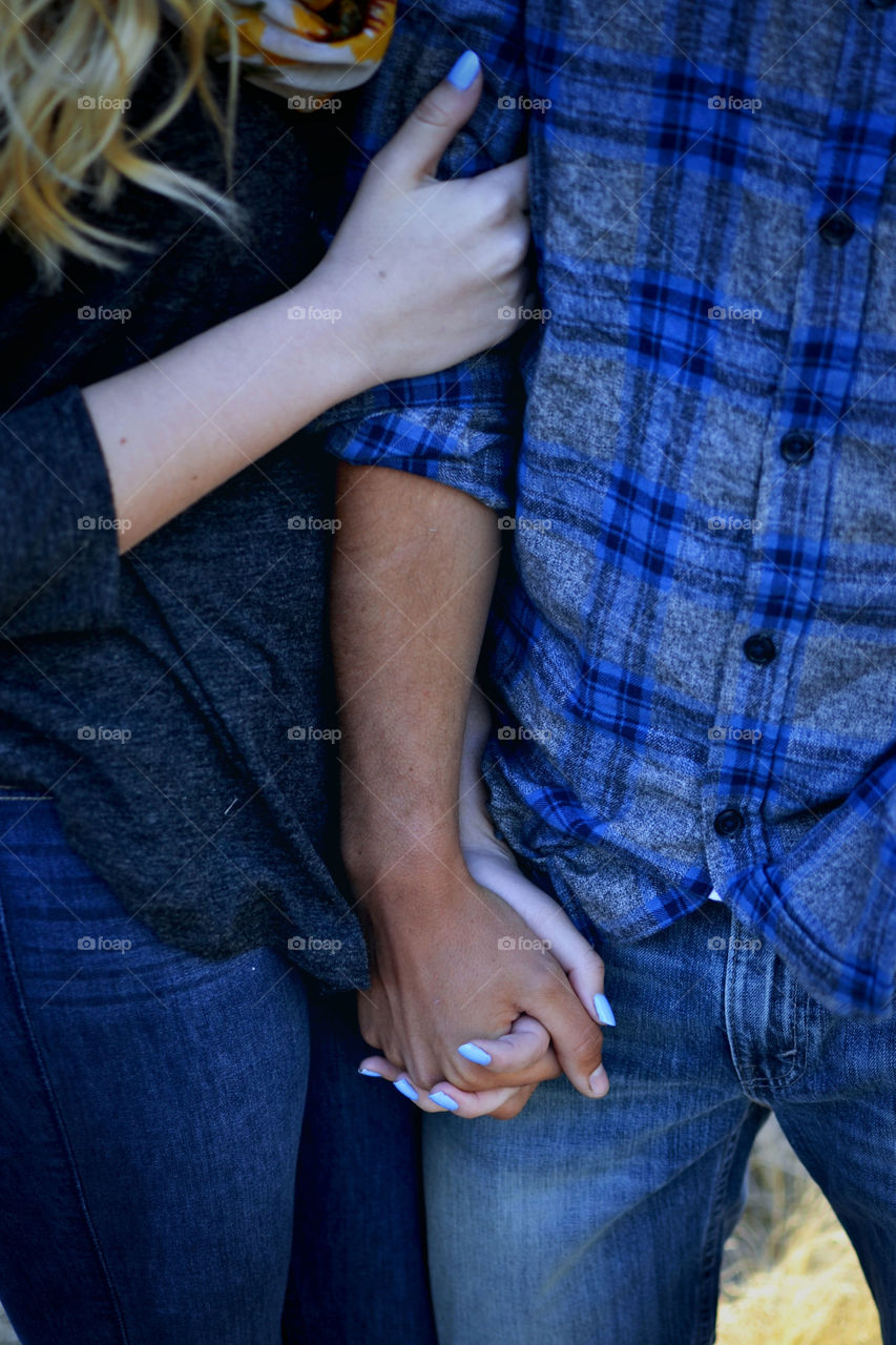 Couple holding hands 