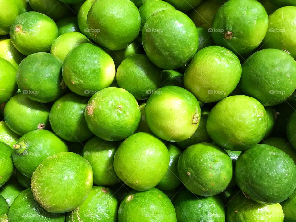 green lemons from Brazil at a street fair