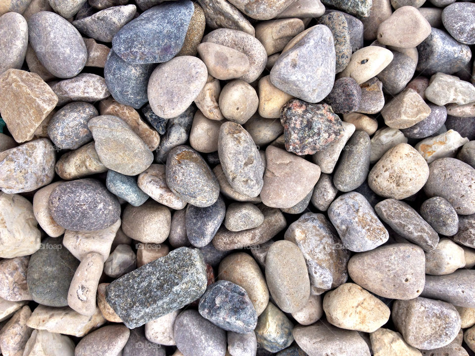 Stone Rocks Background Design. Close Up Of Small Rocks Stones For Use As A Natural Organic Background 