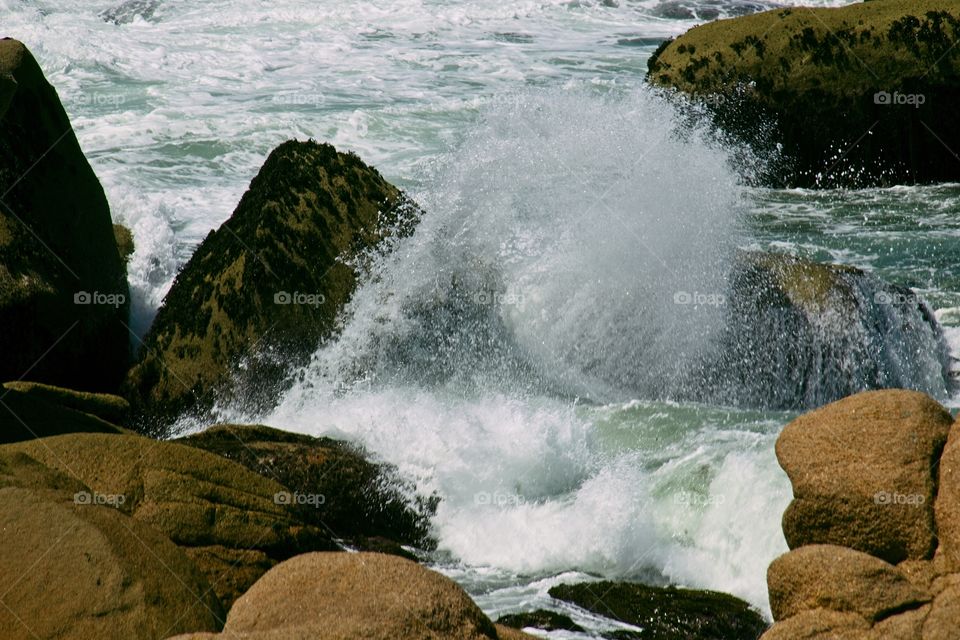 waves crashing on rocks