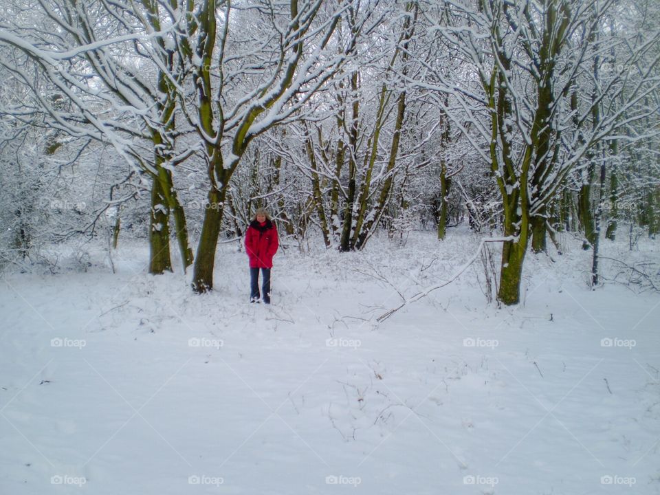 Young woman standing in snowy landscape