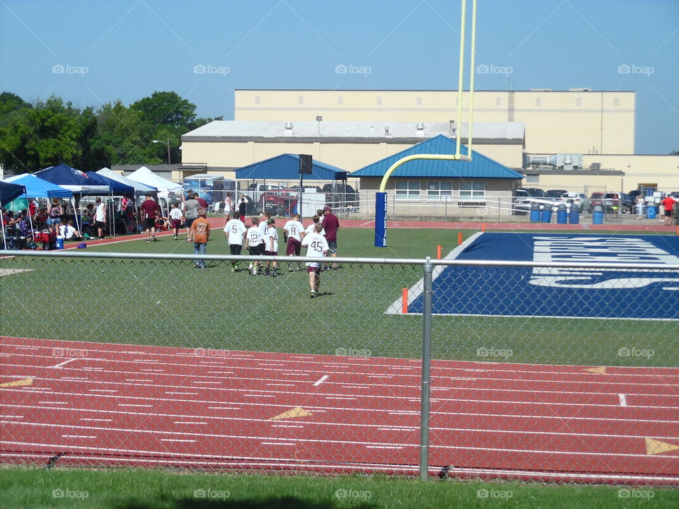 football 🏈 festival. This is a picture of some kids playing in the local summer league