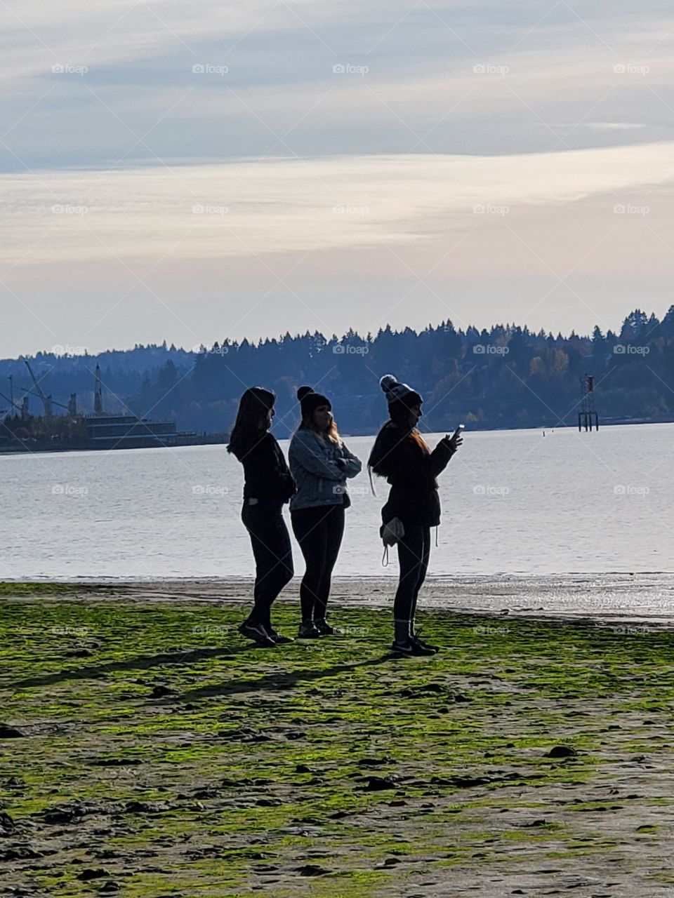 3 girl silhouette and foggy Autumn Bay