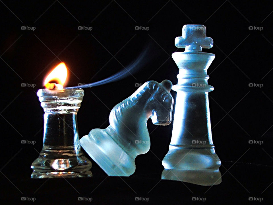 Chess piece against black backgrounds