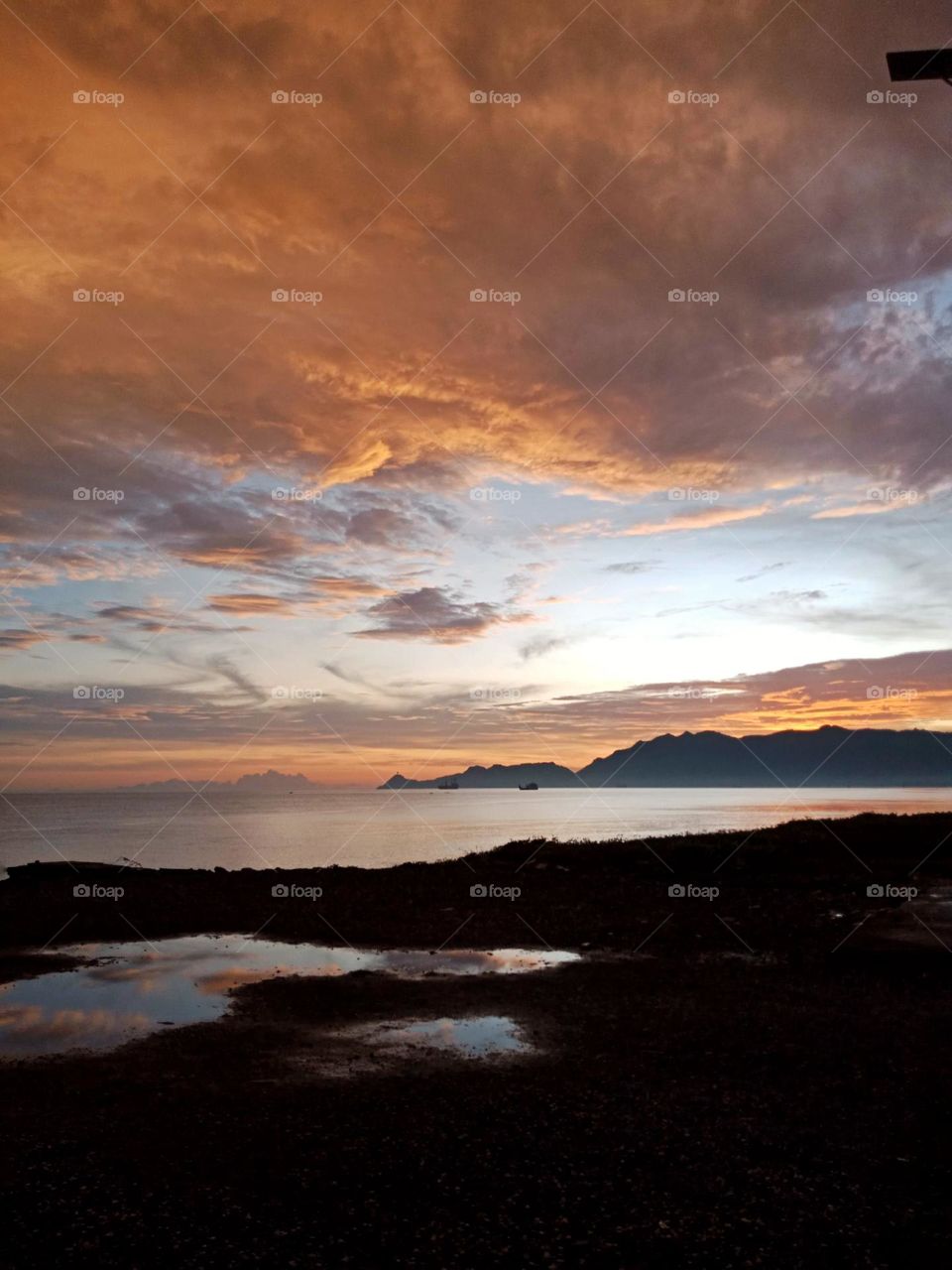 Sunset in Díli, view of Cristo Rei from Comoro river