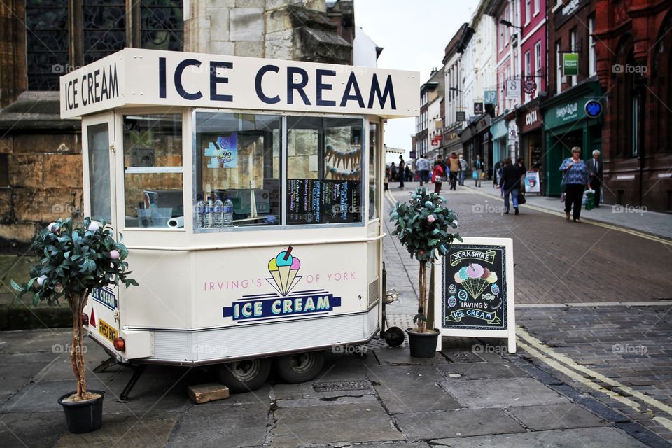 An Ice Cream van on a city street.