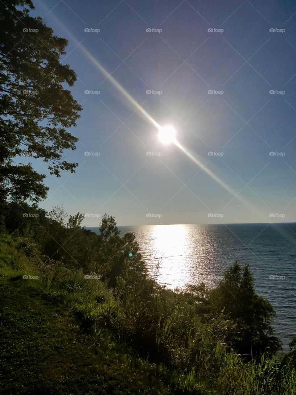 The sunlight reflects on the lake water