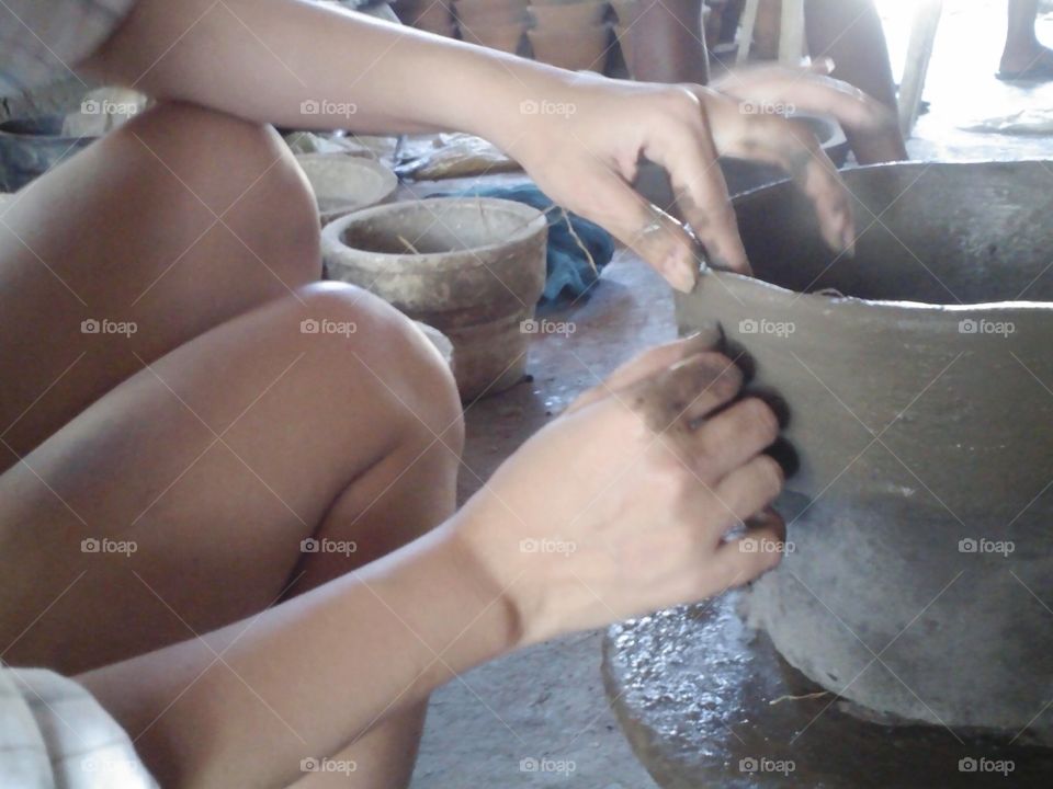 woman creating a pot