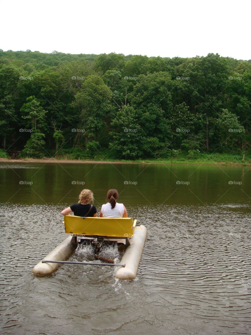 Two girls enjoying a sunny day on a local lake  in Arkansas. 