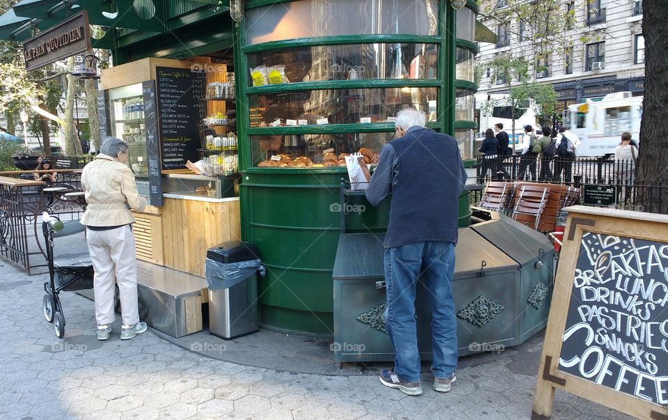 Elderly Couple From Behind at Outdoor Food Shop