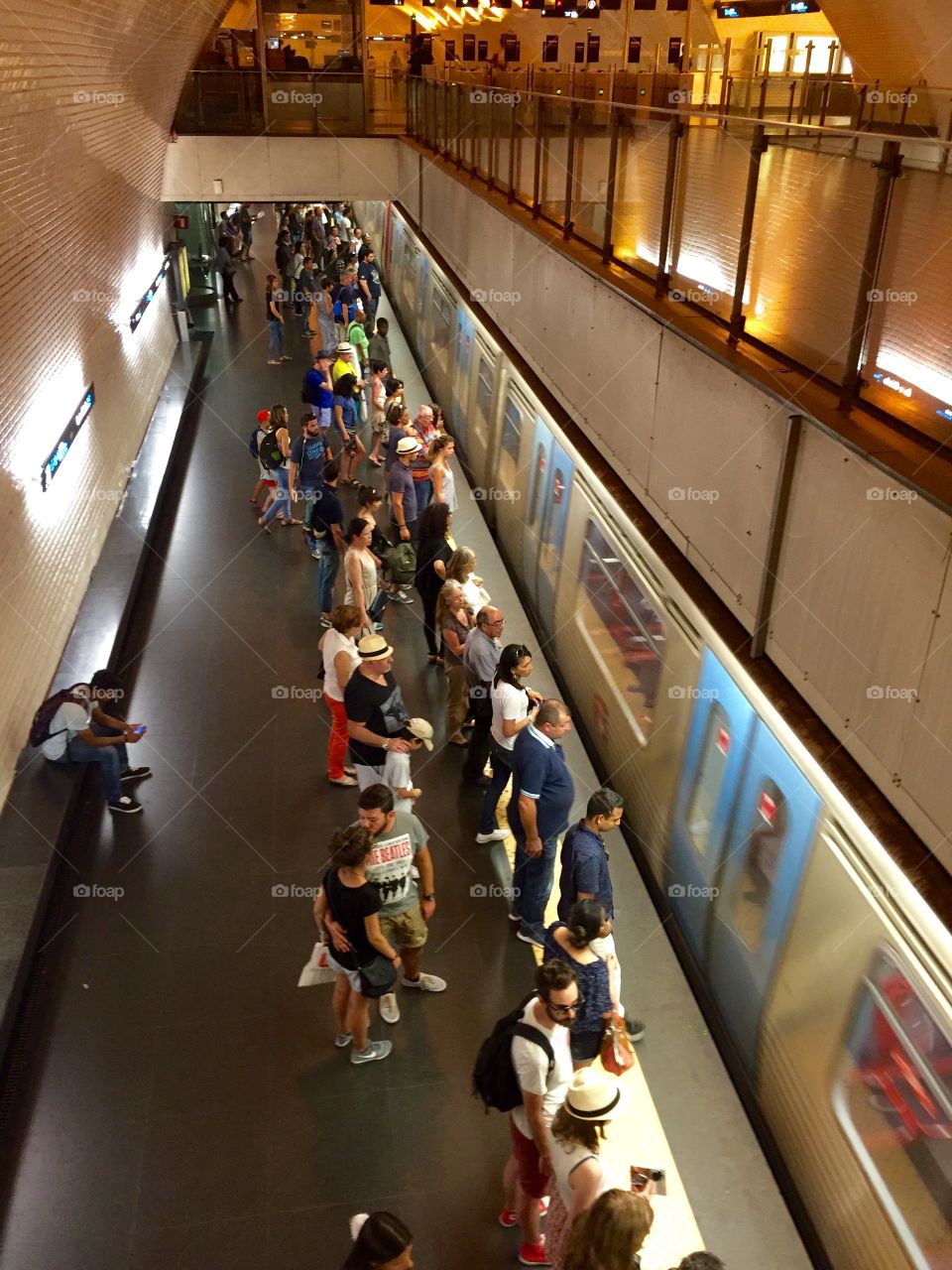 People using the underground metro train in Portugal 