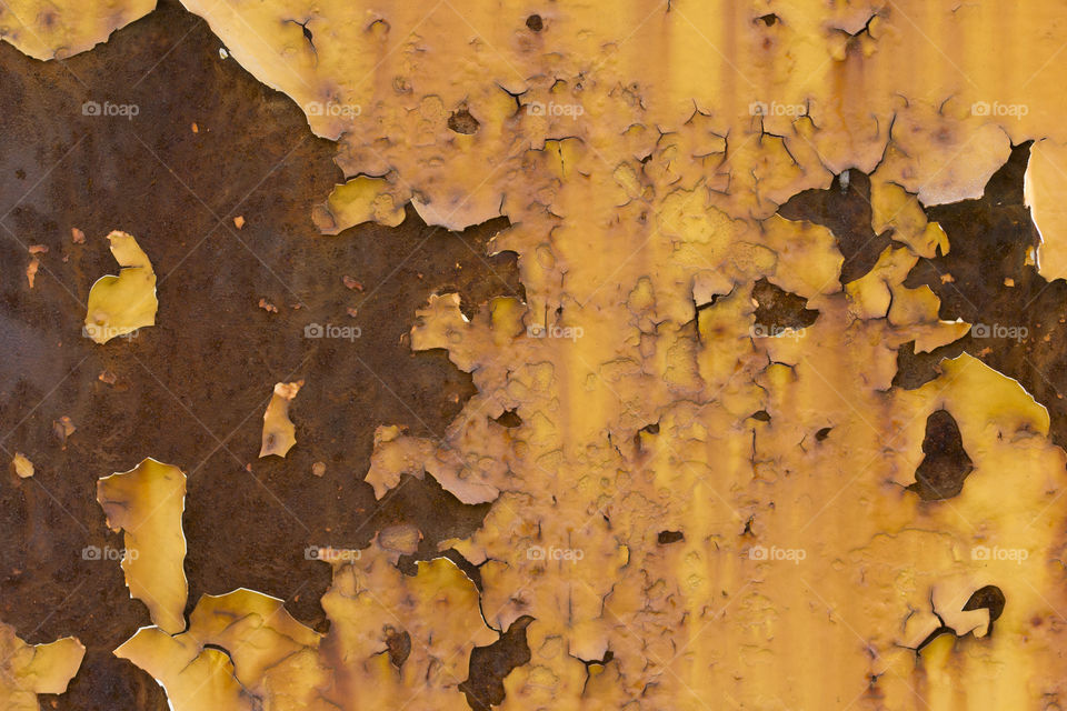 texture of an yellow peeled paint . macro shot