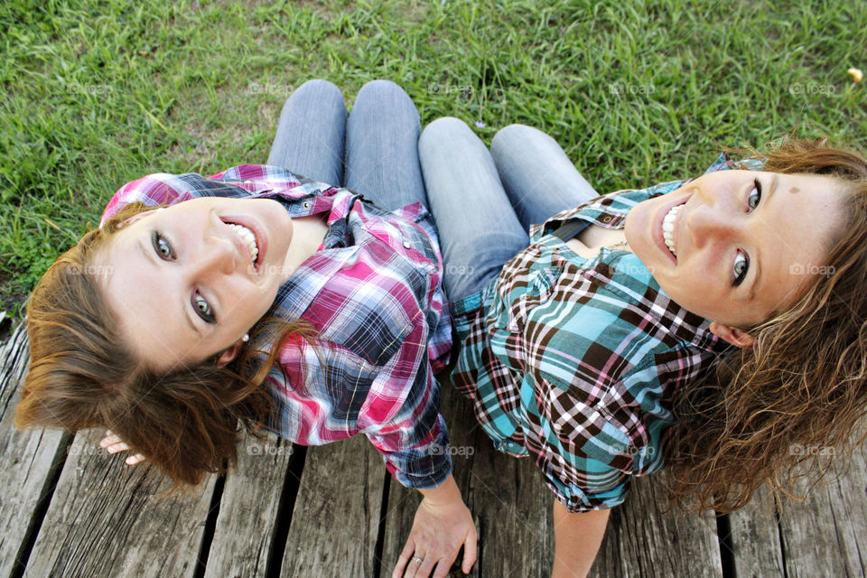 Twins sitting smiling happy