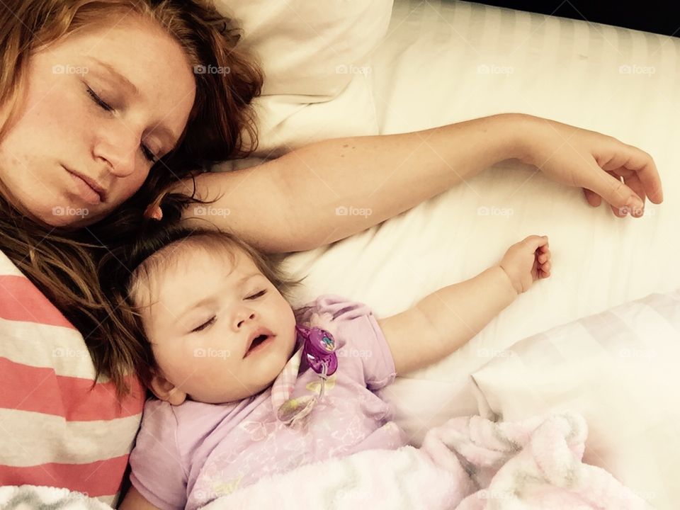 Nap Time. Mother and daughter enjoying a nap together