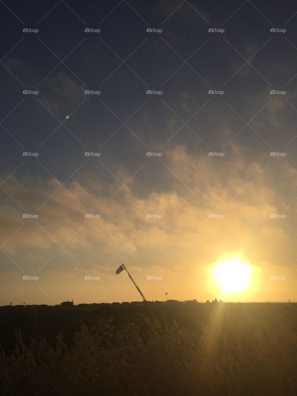 American flag hanging in the sunset 