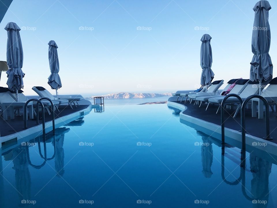 Mountain edge pool on the beautiful Santorini island 