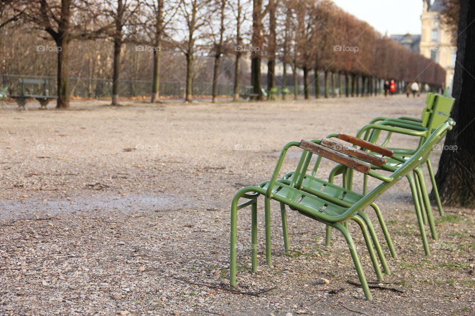 Green chairs at the park