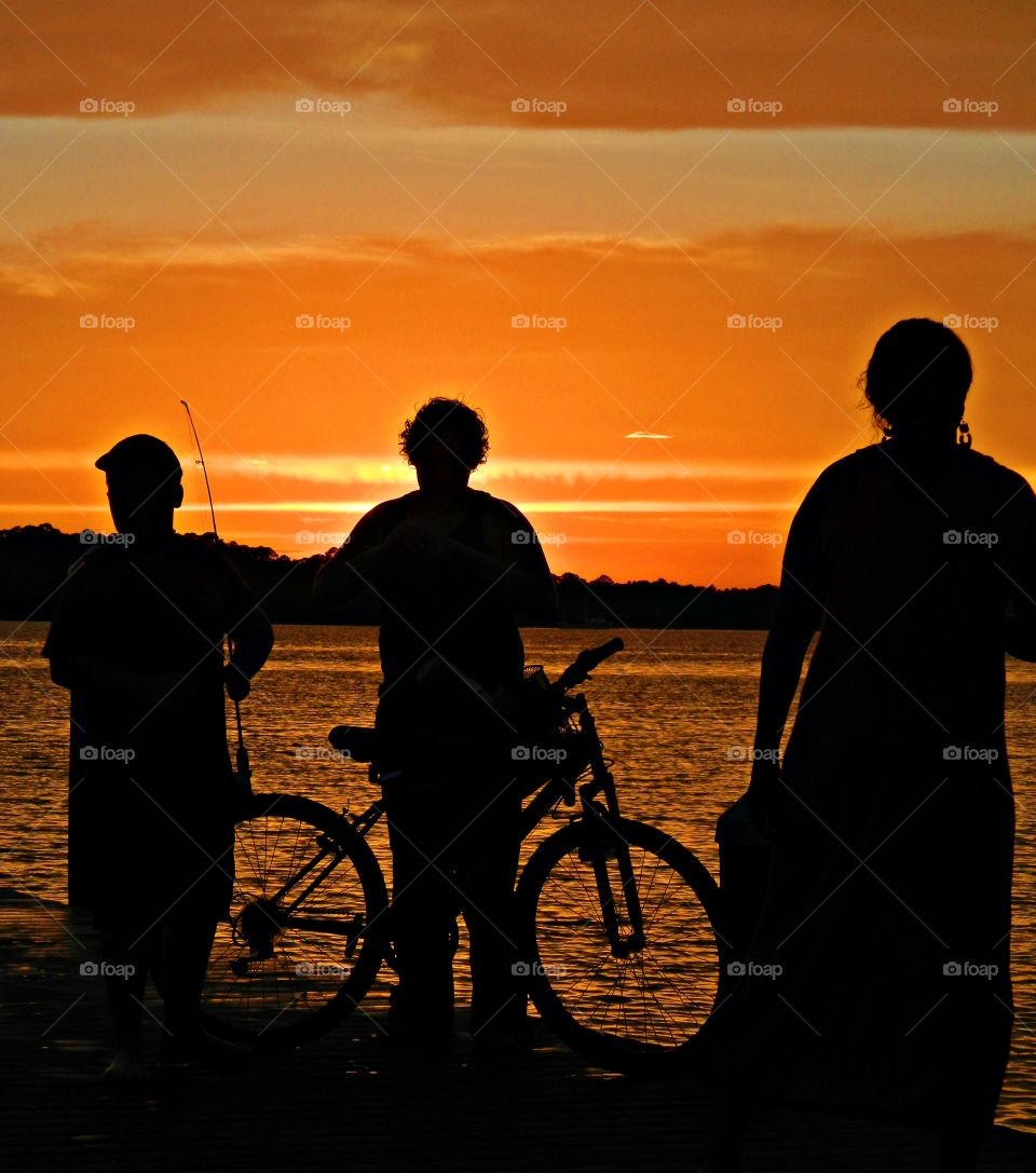 World of silhouettes and shadows -  A Fishing boat silhouette against a bright orange sunset!