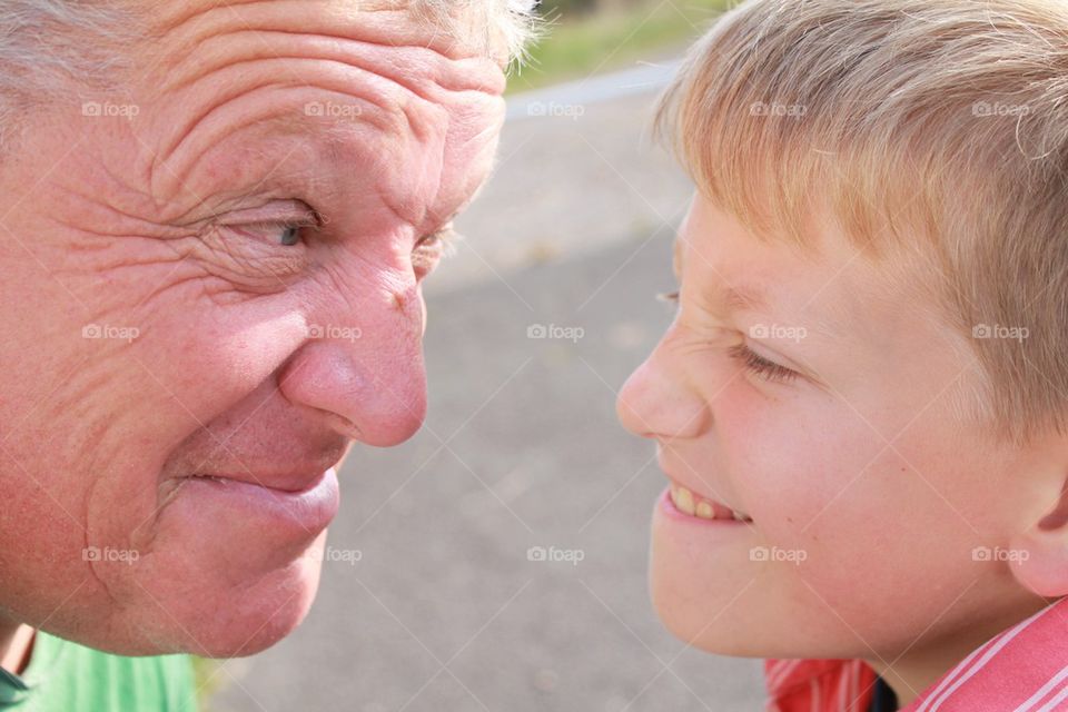 Father and son communicating through facial expressions 