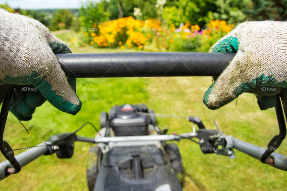 Mowing lawn in the garden