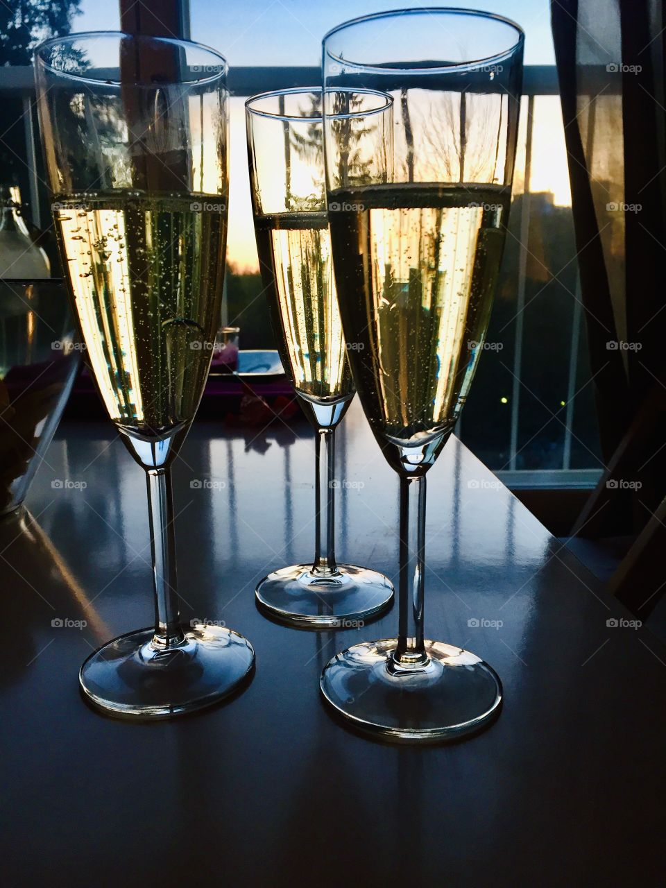 Three glasses of champagne. Celebrating the summer beginning with friends.