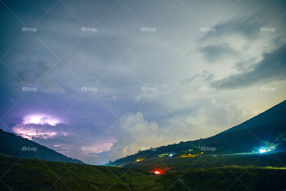 Lightning boomed at the foot of Mount Gede. Climbing the mountain during the rainy season is always full of challenges