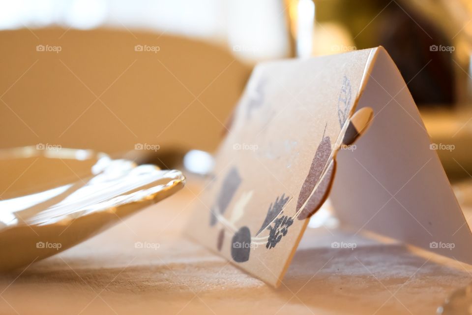 Place card on dinner table set for Thanksgiving holiday feast 