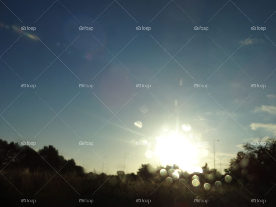 golden hour. Golden hour behind glass after rain