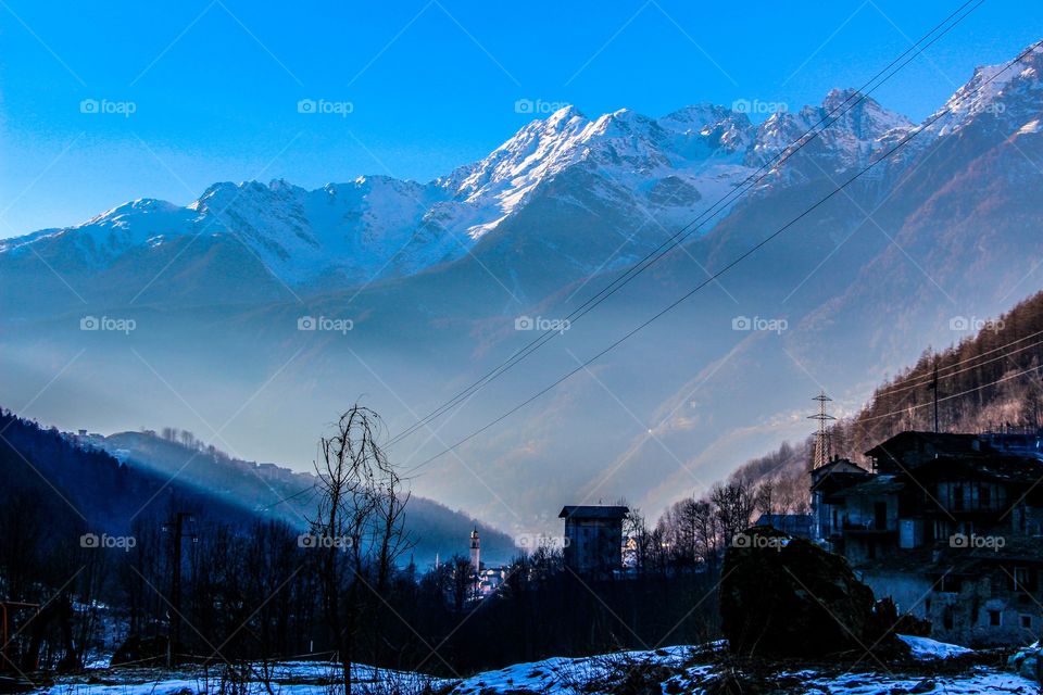 City view with snow mountains