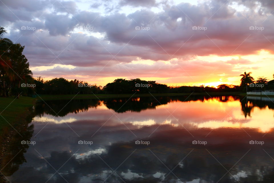 Multi colored layered sunset reflection