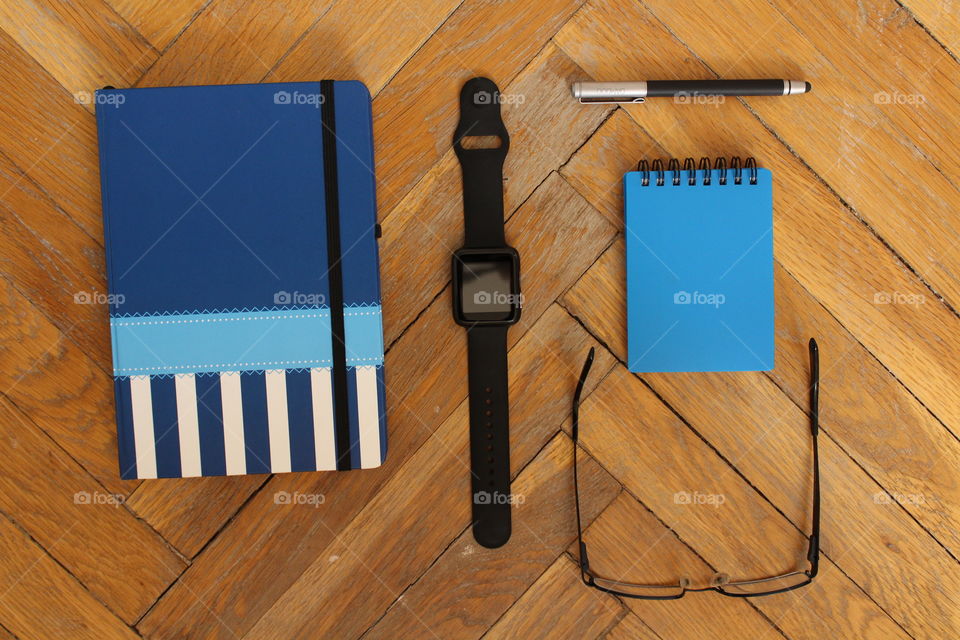 pen watch and notebook